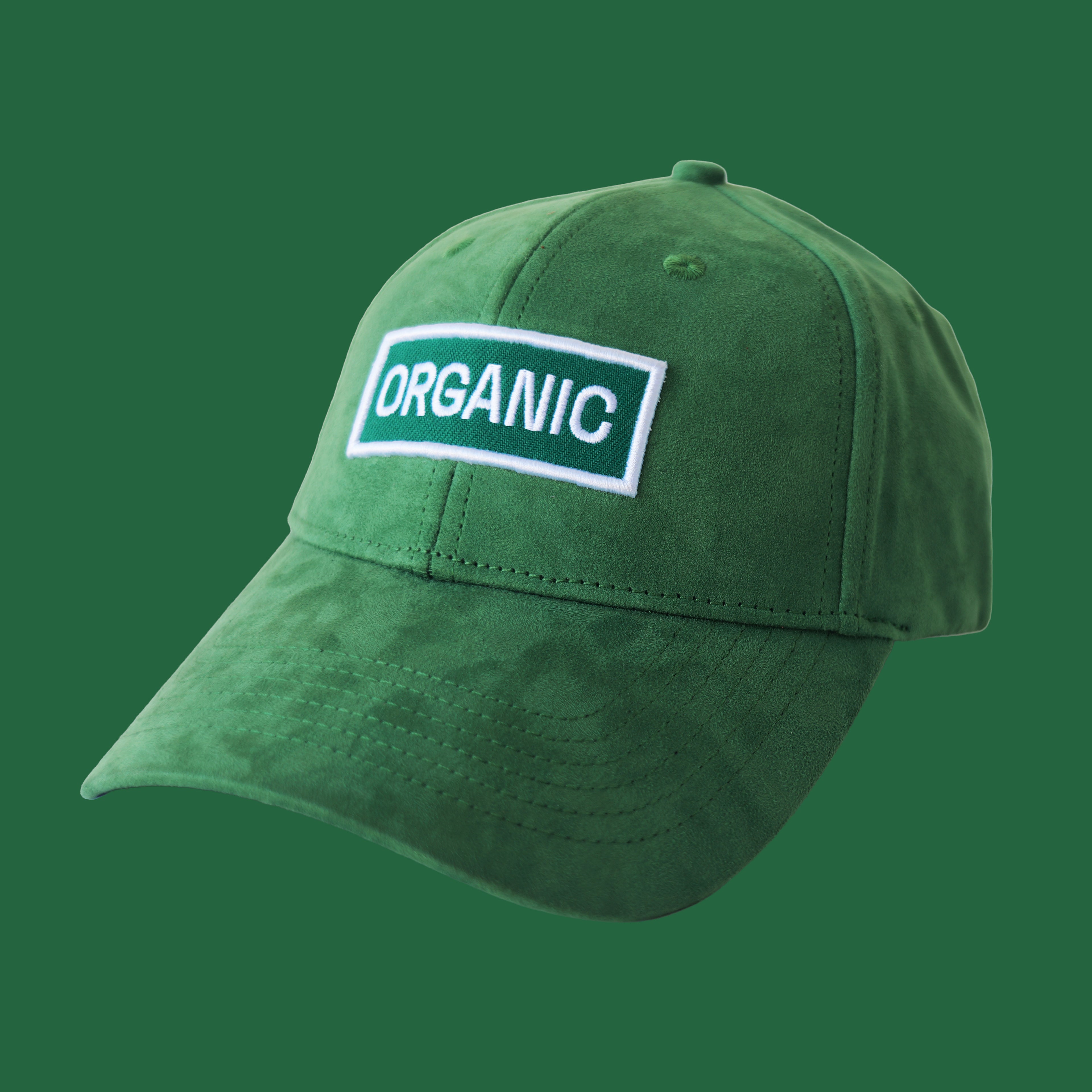 Professional studio shot of bABP "ORGANIC" green eco-suede hat with a tonal white and green embroidered logo patch, featured on a matching monochromatic green background