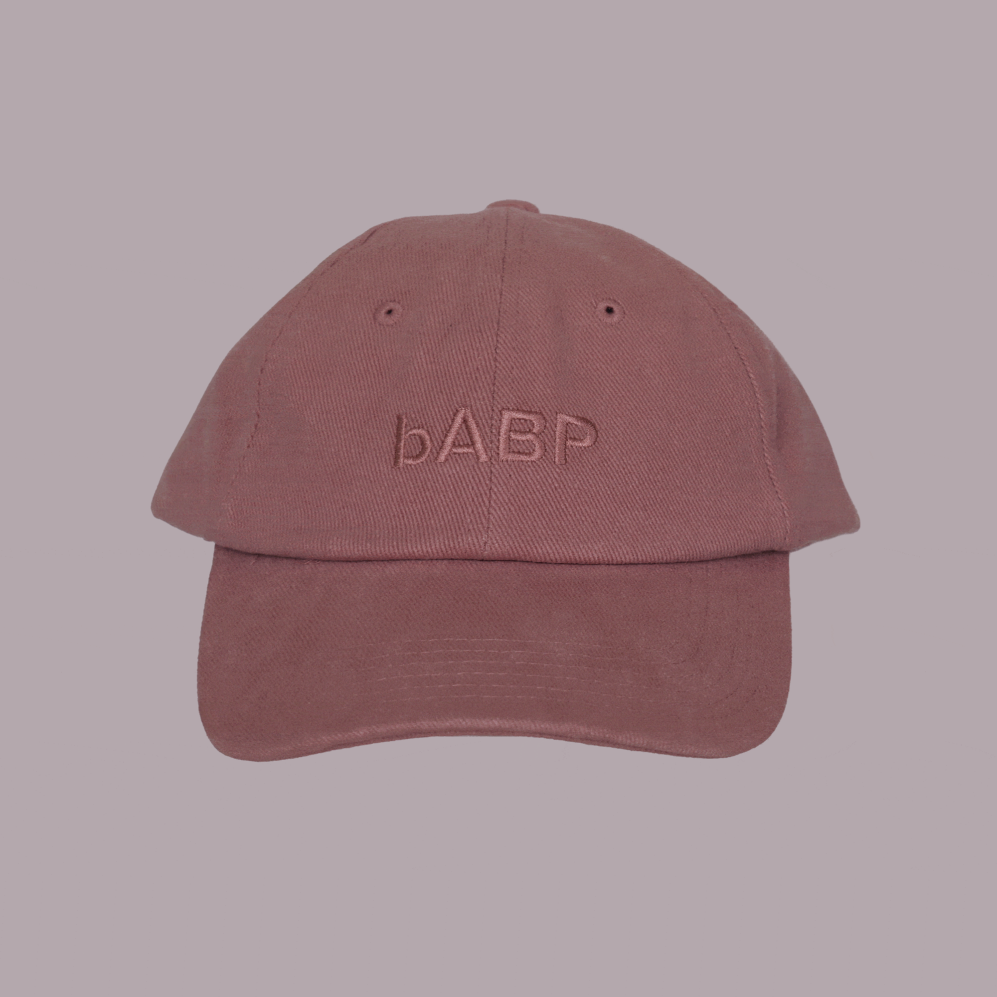360-degree spinning view of bABP B-SIDE signature pink cotton dad hat with tonal logo embroidery, showing washed texture and adjustable strap