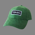 Front view of bABP "TRASH" green eco-suede hat with a black and white embroidered logo patch, Signature Collection